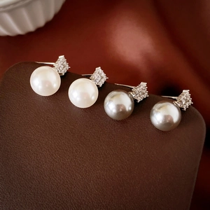 Elegant white and grey pearl stud earrings with sparkling cubic zirconia on silver base