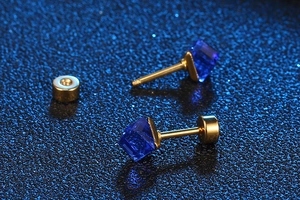 Close-up of blue square-cut gemstone earrings with gold-plated metal stud and backing
