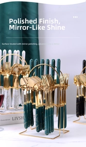 Close-up of marble pattern handle cutlery set with mirror polished finish on gold stand