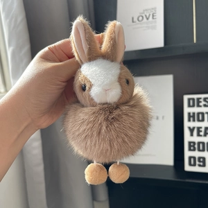 Cute brown and white plush bunny keychain with fluffy fur for bags and car keys