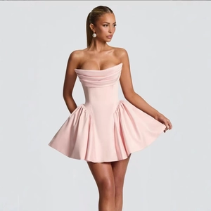 Pink strapless mini dress with structured corset top and pleated skirt for women