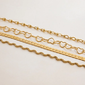 Classic 18K gold plated stainless steel bracelets with heart and flat chain designs