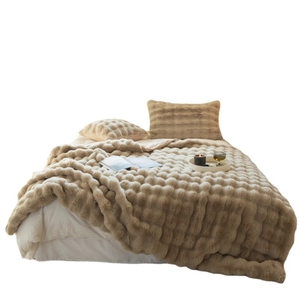 Luxurious khaki faux rabbit fur blanket with embossed texture and soft warm plush fibers