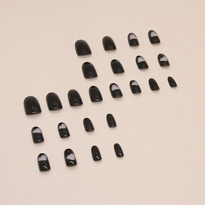 Glossy black oval press-on nails with glitter hollow heart designs, set of 24 pieces