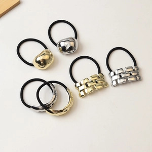 Polished gold and silver alloy hair ties with geometric metal charms in minimalist style