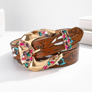 Brown leather belt with golden rhinestone buckle and intricate floral pattern carvings