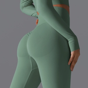 Detail of sage green seamless yoga set showing ribbed fabric texture and ruched butt lift