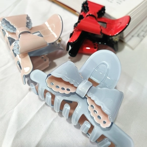 Elegant bow hair clips in pink, red, and light blue acetate with lace details