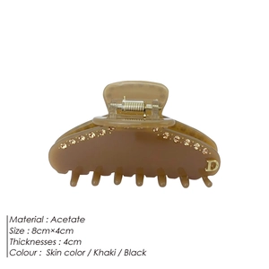Pinza per capelli minimalista in acetato con strass e dettaglio dorato lettera D