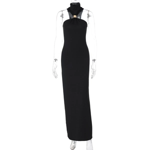Detail of elegant black bodycon dress with gold ring neckline and high side slit design