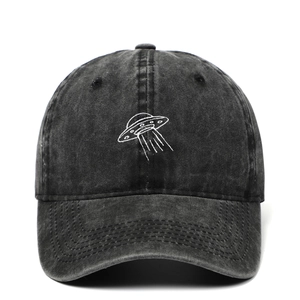Washed black cotton baseball cap featuring white UFO embroidery and a curved wide brim