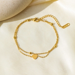 Elegant gold double-layered heart charm bracelet in stainless steel with beads