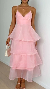 Detailed close-up of pink layered tulle fabric on a sexy backless tiered evening dress