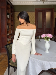 Elegant white off-shoulder long sleeve knit top and slim maxi skirt two-piece set