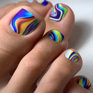 Close-up of square press-on toenails featuring a vibrant rainbow marble swirl pattern