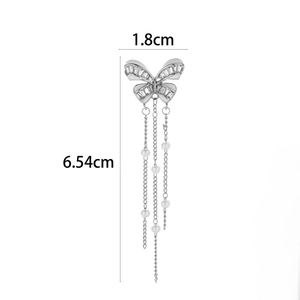 Macro shot of butterfly ear cuff with size markings 1.8cm width and 6.54cm length