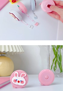 Close-up of pink rabbit cartoon measuring tape showing retractable 1.5m soft ruler scale