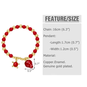 Detail view of 16cm beaded bracelet with strawberry and turtle charms in 18k gold plating