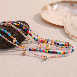 Colorful beach style necklace with 18K gold plated steel, acrylic beads and shells