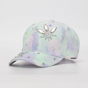 Close-up of children's tie-dye baseball cap with colorful rhinestone flower design