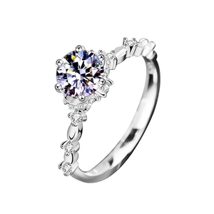 925 silver flower ring with round moissanite and side stones on white background