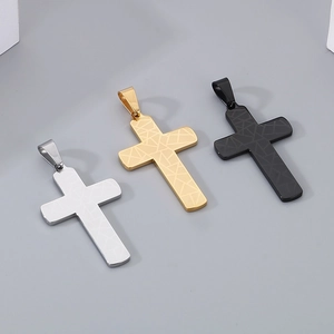 Detailed view of stainless steel cross pendants in silver, gold, and black with cracked texture