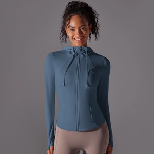 Detail of hooded sports jacket with zipper, drawstrings and side pockets in misty blue