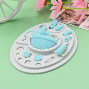 Detailed food grade silicone mold showing baby carriage, bottle, and tiny shoe shapes