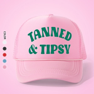 Close-up of pink foam trucker hat with TANNED & TIPSY print and adjustable mesh back