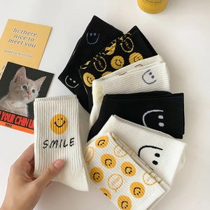 Mid-calf cotton socks with cartoon smiley face and Smile text embroidery in diverse colors