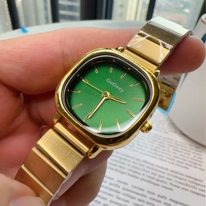 Elegant gold square watch with a vintage green dial and stylish metallic chain strap