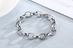 Detailed macro view of industrial titanium steel chain bracelet with classic OT buckle