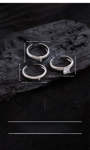 Detailed view of silver plated open rings with cubic zirconia and S925 engraved texture