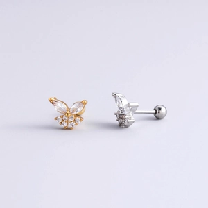 Detailed view of butterfly cartilage studs in gold and silver with clear cubic zirconia