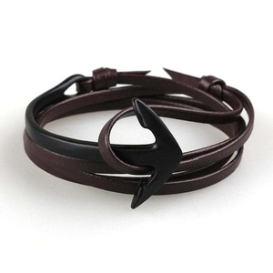 Close-up of brown leather multilayer bracelet with black metal anchor hook clasp