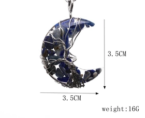 Detail view of crescent moon pendant with life tree wire wrap and blue stones