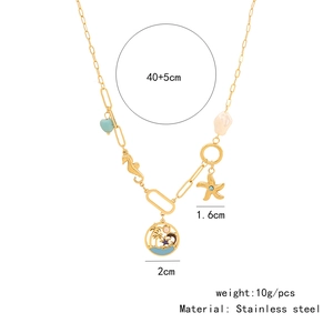 Detail of bohemian gold stainless steel necklace with seashell and starfish charms