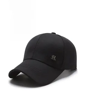 Close-up of black baseball cap featuring a detailed SR metal logo on breathable cotton