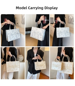Detail view of butterfly embroidery tote bag with dual handles in two stylish colors