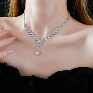 Sparkling silver teardrop zircon necklace displayed on a model with elegant lighting