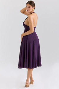 Detail view of backless halter dress showing purple chiffon texture and side cut silhouette