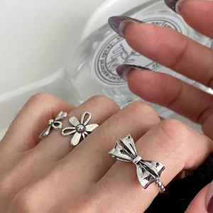 Vintage hollow flower and bow open rings in retro silver finish for women fashion