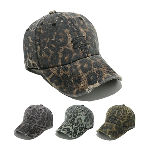 Detail showing vintage leopard print baseball caps in four colors with embroidery