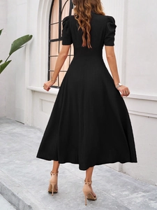 Back view of elegant black V-neck dress with short sleeves and vertical stripes