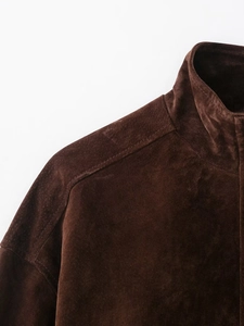 Close-up of the shoulder and collar texture on a dark brown suede casual jacket