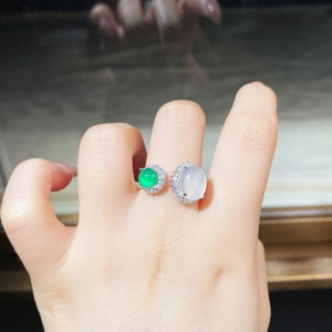 Detail of dual stone silver ring featuring green chalcedony and white translucent jadeite