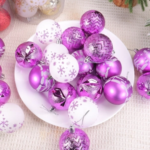 Purple and white painted Christmas ornament ball set with glitter patterns on beige fabric
