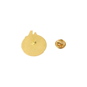 Golden alloy airplane pin back with butterfly clutch fastener on white background