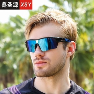 Outdoor sports sunglasses with blue mirror lenses and black matte frames worn by a male model
