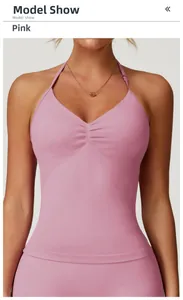 Detail of dusty pink seamless yoga tank top with halter neck and ruched front design